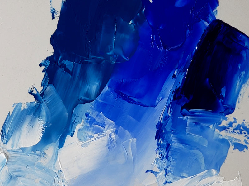 Swatch showing Cerulean Blue at left, Cobalt Blue at center and Phthalo Blue at far right. Each tinted with Titanium White along the bottom.