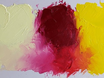 Ruby Rose shown at center with Brilliant Lemon Extra Pale at left and Brilliant Lemon at right. All three are spread out right from the tube across the top and at bottom, the Ruby Rose is mixed with each of these cool yellows, creating a soft pink tint with the Extra Pale and a vivid orange with the regular Brilliant Lemon.