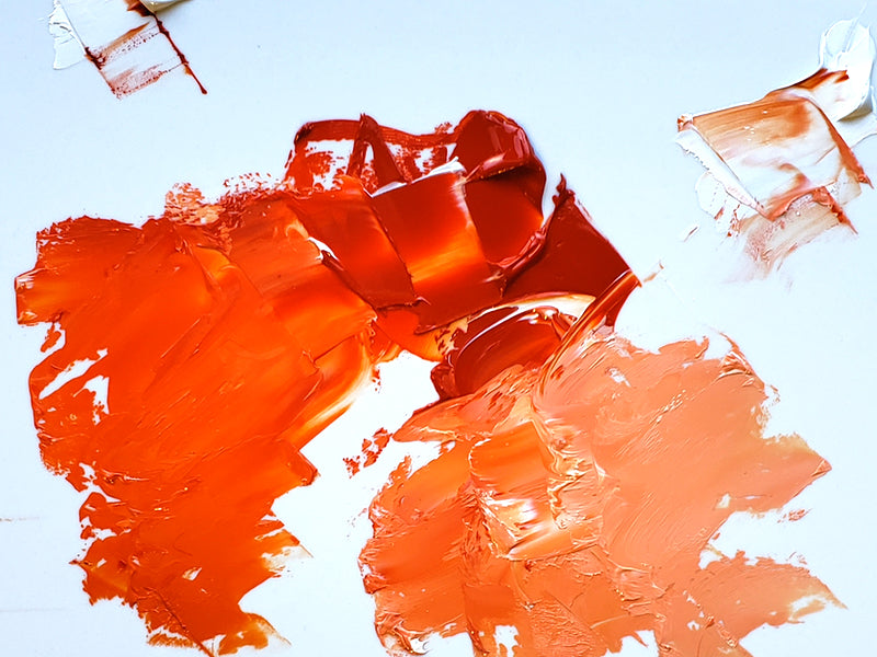 Transparent Orange at center with our Flake White tinting it a left and our Titanium White tinting it at right.