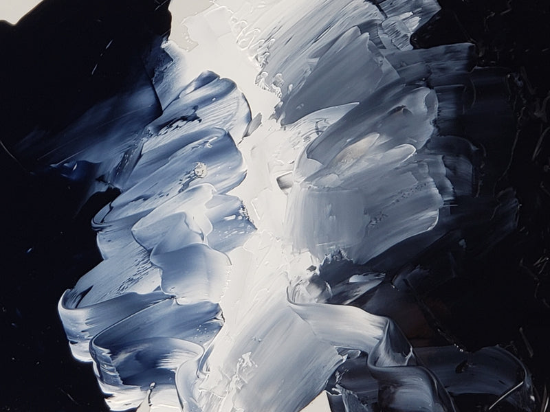 Imaged here is Night Black at left and Payne's Gray at far right, with our Titanium White down the center, tinting each of the blacks to reveal their distinct color and tone.