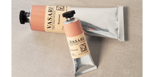 Small 40ml size tube in front of Large 175ml tube of our new Rosewood chromatic gray with hand painted labels