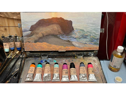 Showing the eight colors found in the Seth Tummins Colors for an Open Palette set, on Seth's palette box, that holds a painting that used them.