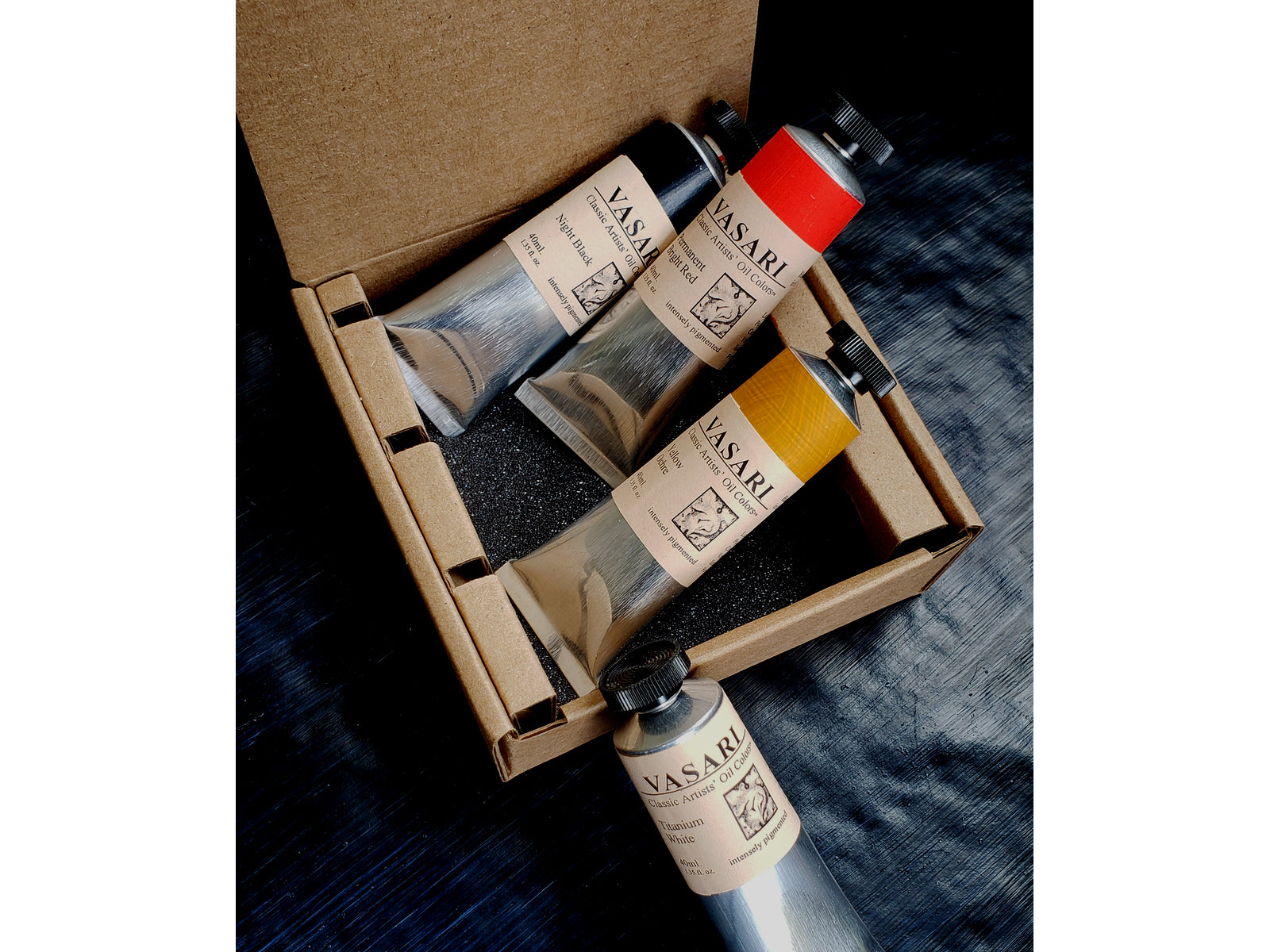 Our Modern Zorn Limited Palette set of four colors in 40ml size tubes, from top to bottom is Night Black,Permanent Bright Red, Yellow Ochre, and Titanium White.