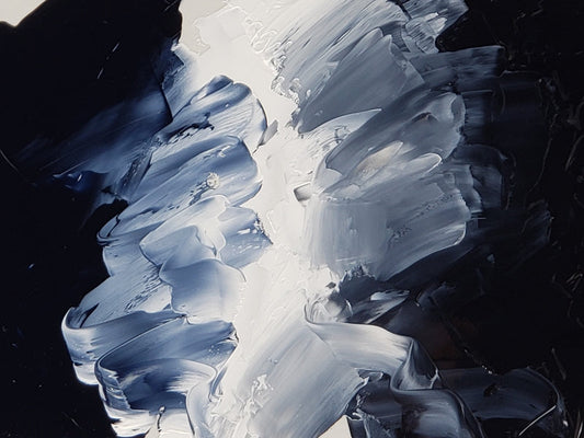 Imaged here is Night Black at left and Payne's Gray at far right, with our Titanium White down the center, tinting each of the blacks to reveal their distinct color and tone.